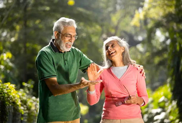 Group of seniors taking a selfie with a caregiver
